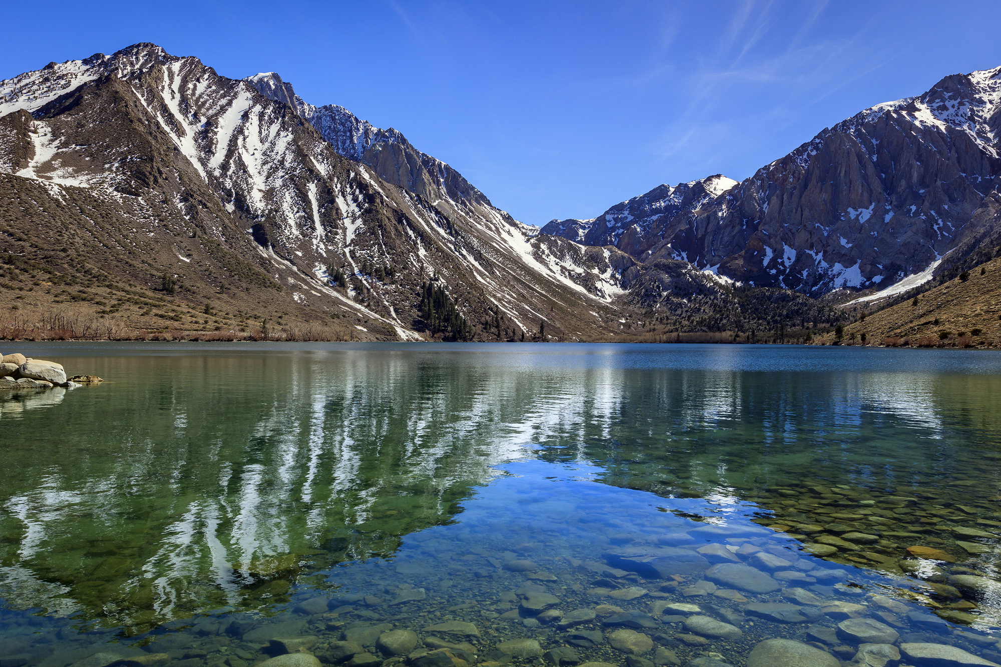 A nice view of Conflict Lake with mountains in background