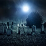 Nighttime view of a haunted cemetery